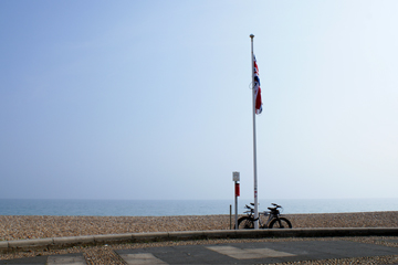 bike and flagpole on the seafront